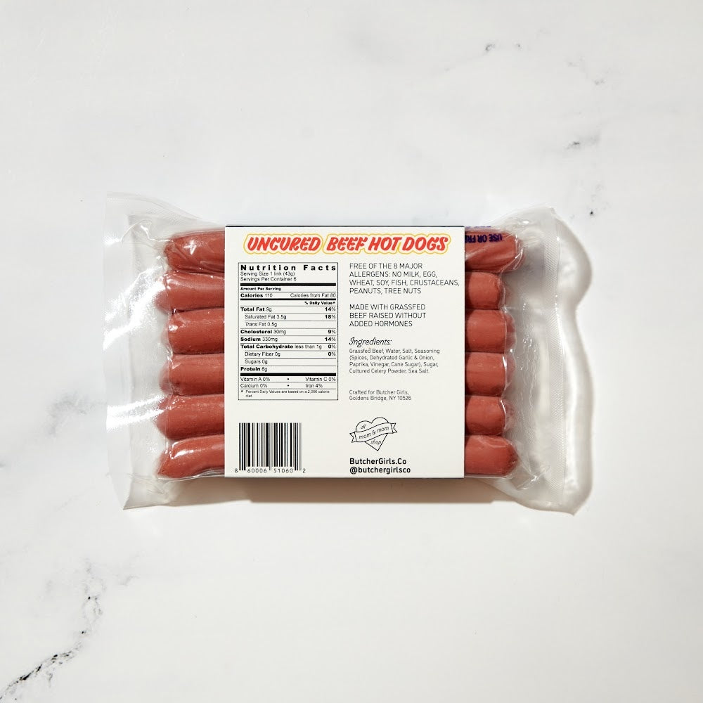 Local and all natural grass-fed beef hot dogs that are uncured. Packaged with games for entertaining the kids. From a Mom and Mom butcher shop, hand delivered to your door from the Butcher Girls.