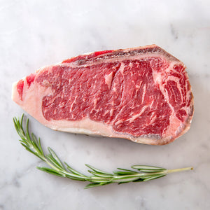 Sustainably raised grass-fed beef New York strip steak.  Hand cut by whole animal butchers.  Delivered straight to your door in time for dinner, from LGBTQA+ run small business, Butcher Girls.
