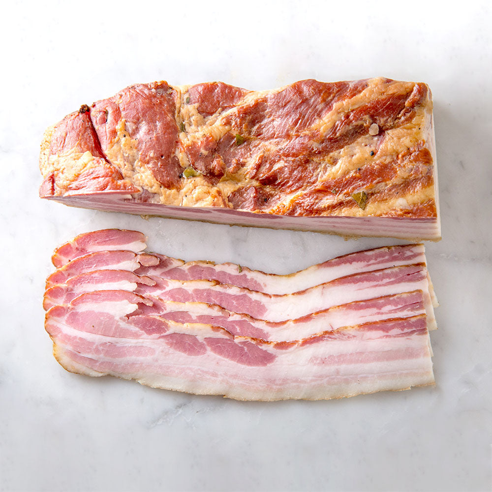 
            
                Load image into Gallery viewer, Bacon cured for 10 days and smoked.  Made without preservatives.  Sliced to order.  Berkshire pork sustainably raised on a family farm.  Delivered straight to your door from a LQBTQA+ run small business, Butcher Girls.
            
        