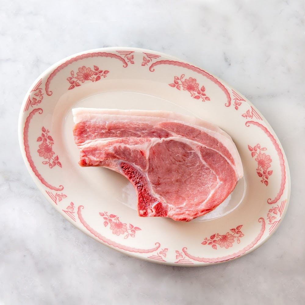 
            
                Load image into Gallery viewer, All natural bone-in heritage (Berkshire) pork chop from Sir William Angus farm in Craryville, New York. From a Mom and Mom butcher shop, hand delivered to your door. 
            
        