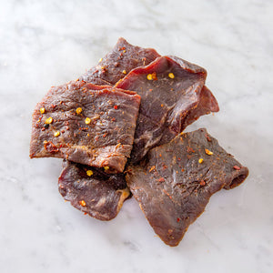
            
                Load image into Gallery viewer, All natural grass-fed beef sourced locally from Autumn’s Harvest farm. Made into a sweet and spicy jerky. Hand delivered to your door from a Mom and Mom butcher shop, Butcher Girls.  
            
        