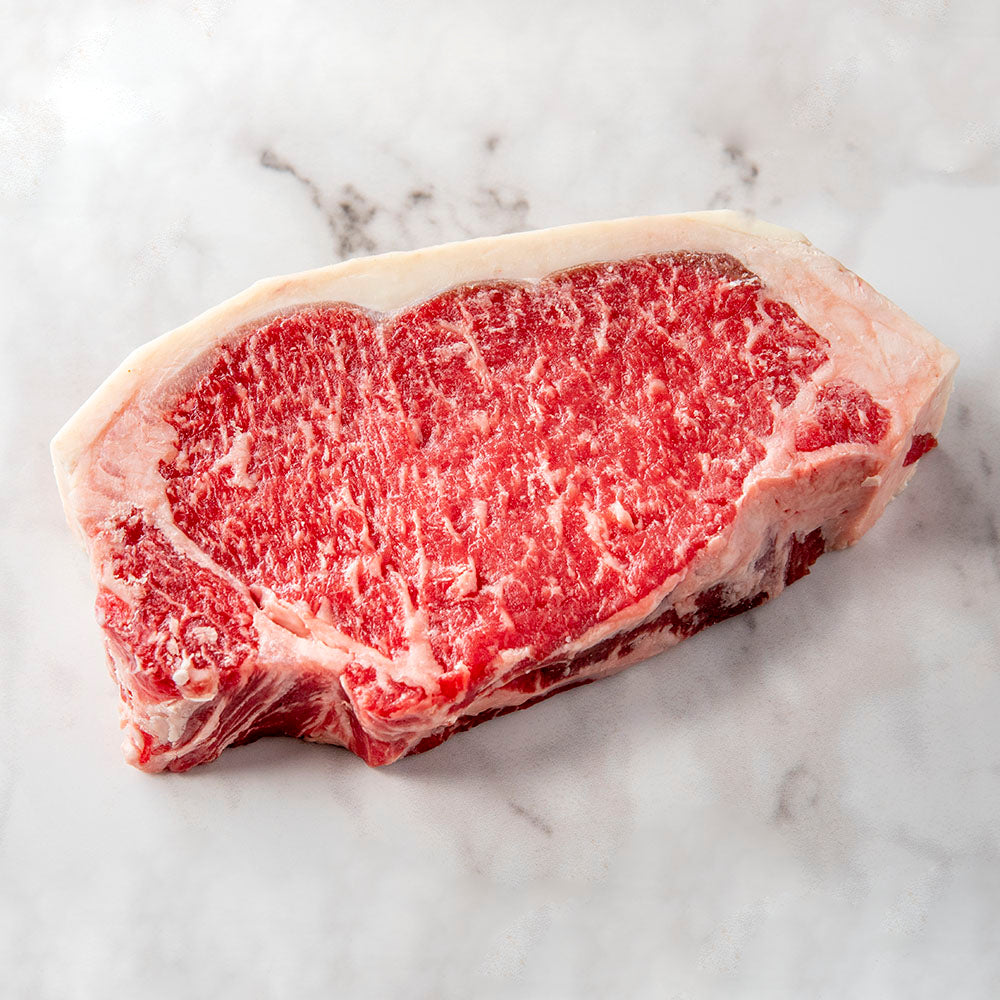 
            
                Load image into Gallery viewer, All natural grass-fed boneless dry-aged New York strip from Autumn’s Harvest in Romulus, New York. Hand delivered to your door from a Mom and Mom butcher shop, Butcher Girls.
            
        