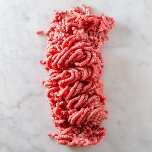
            
                Load image into Gallery viewer, A box of essential meats: one half pound of all natural grass-fed ground beef, one half pound of ground heritage pork or pastured lamb, and two types of hand made sausage. Hand delivered to your door from a Mom and Mom butcher shop, Butcher Girls.
            
        